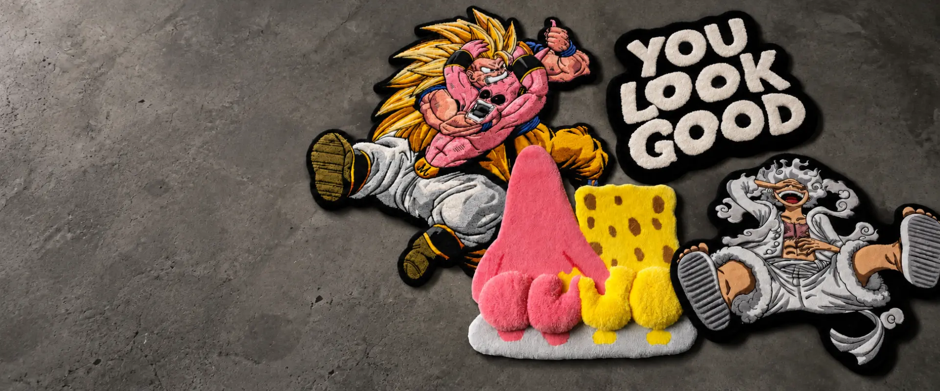 Colorful RUGLAB character rugs arranged on a concrete floor