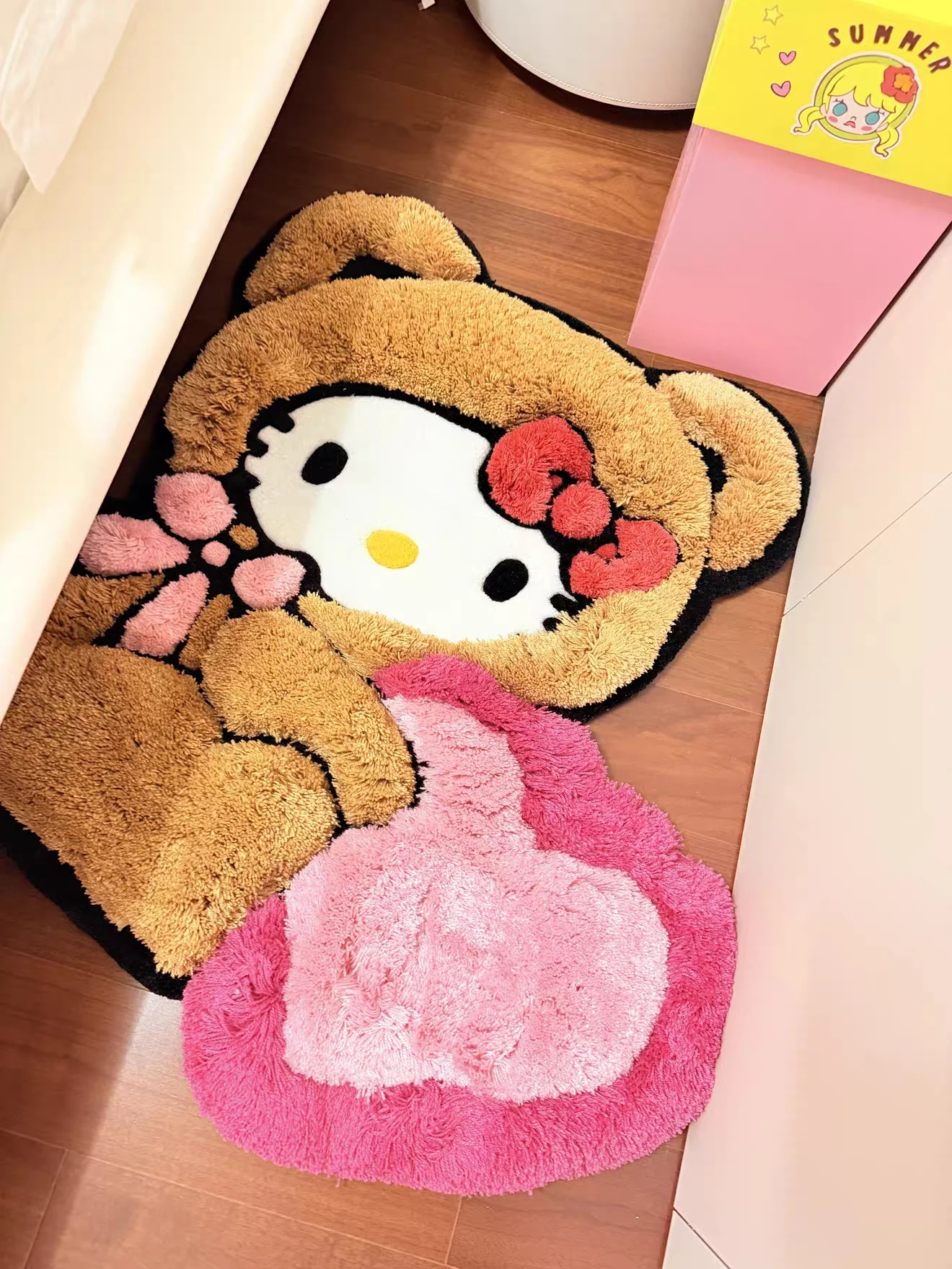 Brown and pink character rug in Mia's bedroom