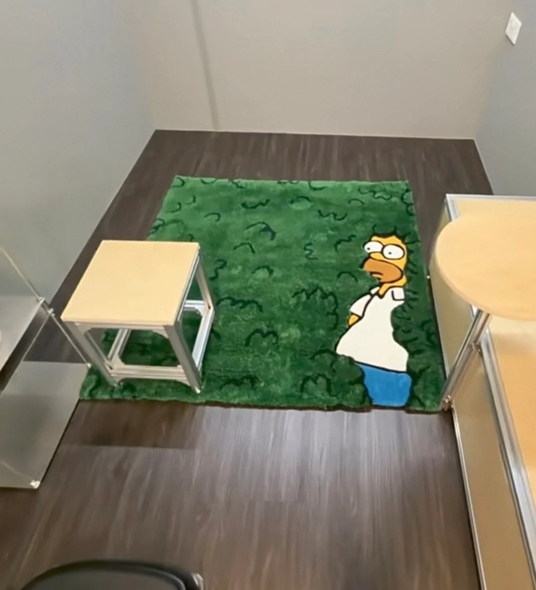Green character rug in Ethan's room