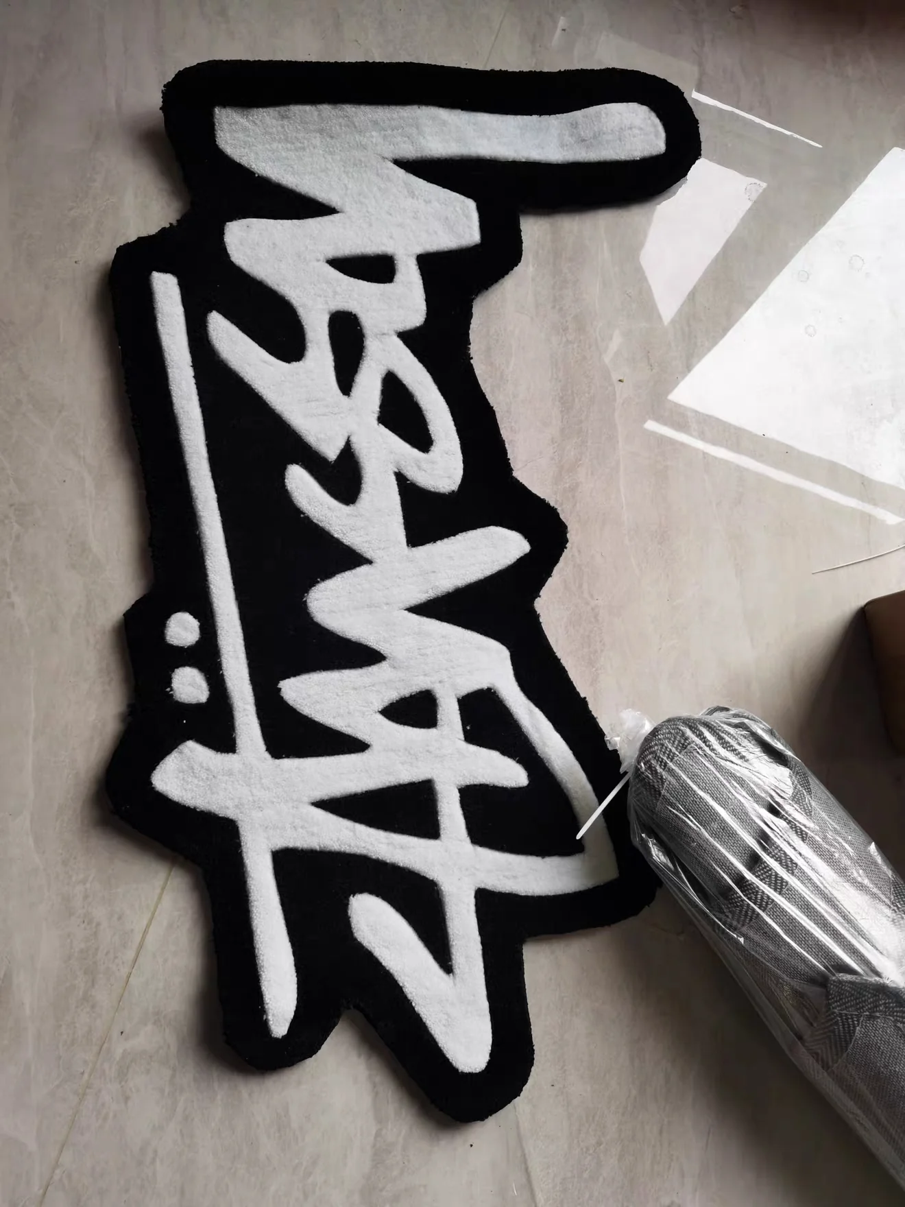 Black and white graphic rug in Noah's space
